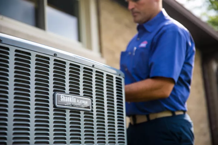 Shanklin technician performing a platinum HVAC unit installation.